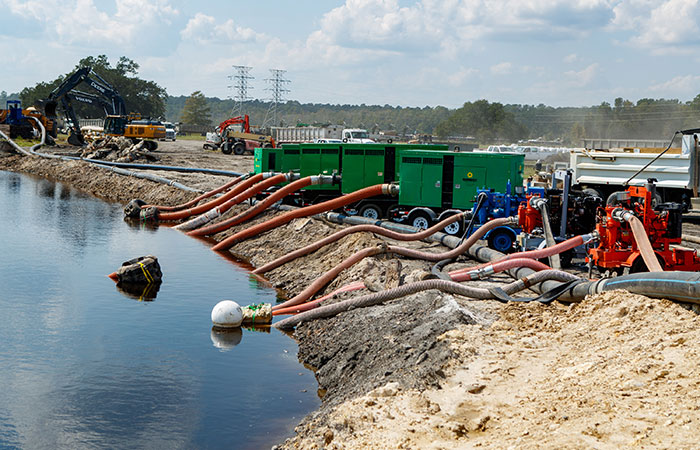 Pumps fill the Grainger ash ponds to equalize the pressure of river levels rising as a result of flooding caused by Hurricane Florence.