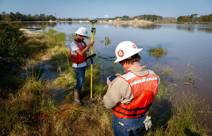 Crews monitor the banks of the Grainger Ash Pond 1 as the river levels overtop the dike of the pond. Saturday, Sept. 22, 2018 in Conway. 