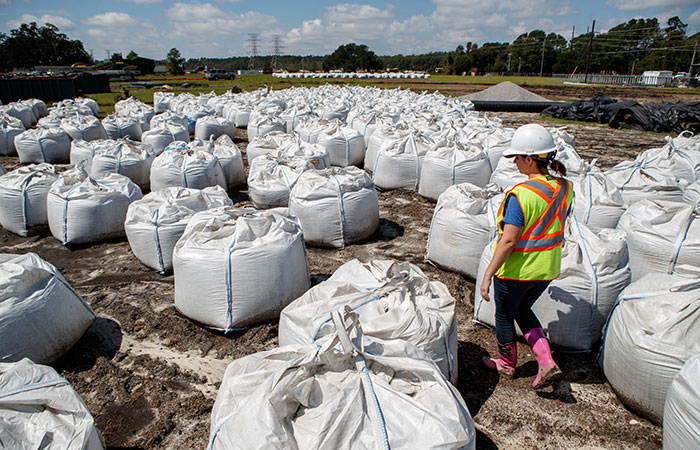 Bags containing 1.5 tons of rock sit ready to deploy by helicopter in the event of a river breach of the dikes surrounding the Grainger ash ponds.