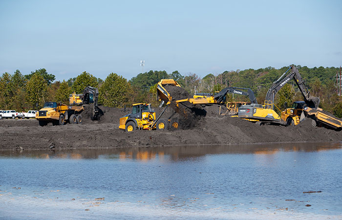 Coal ash in Pond 2 is piled to minimize any leakage as crews work to fortify the banks of the Grainger ash ponds before river levels rise as a result of flooding caused by Hurricane Florence.