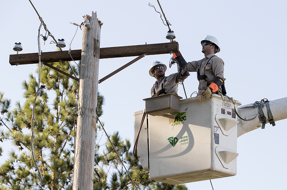 Employees Restoring Power to Customers